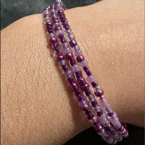 3 strand Hand Beaded Purples slinky bracelet